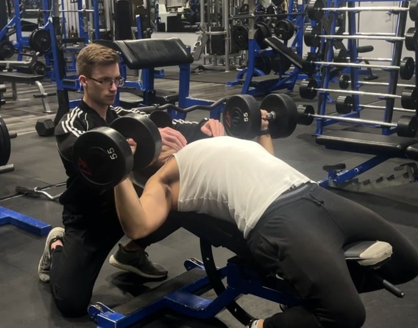 Personal Trainer
          Markham helping client with bench press